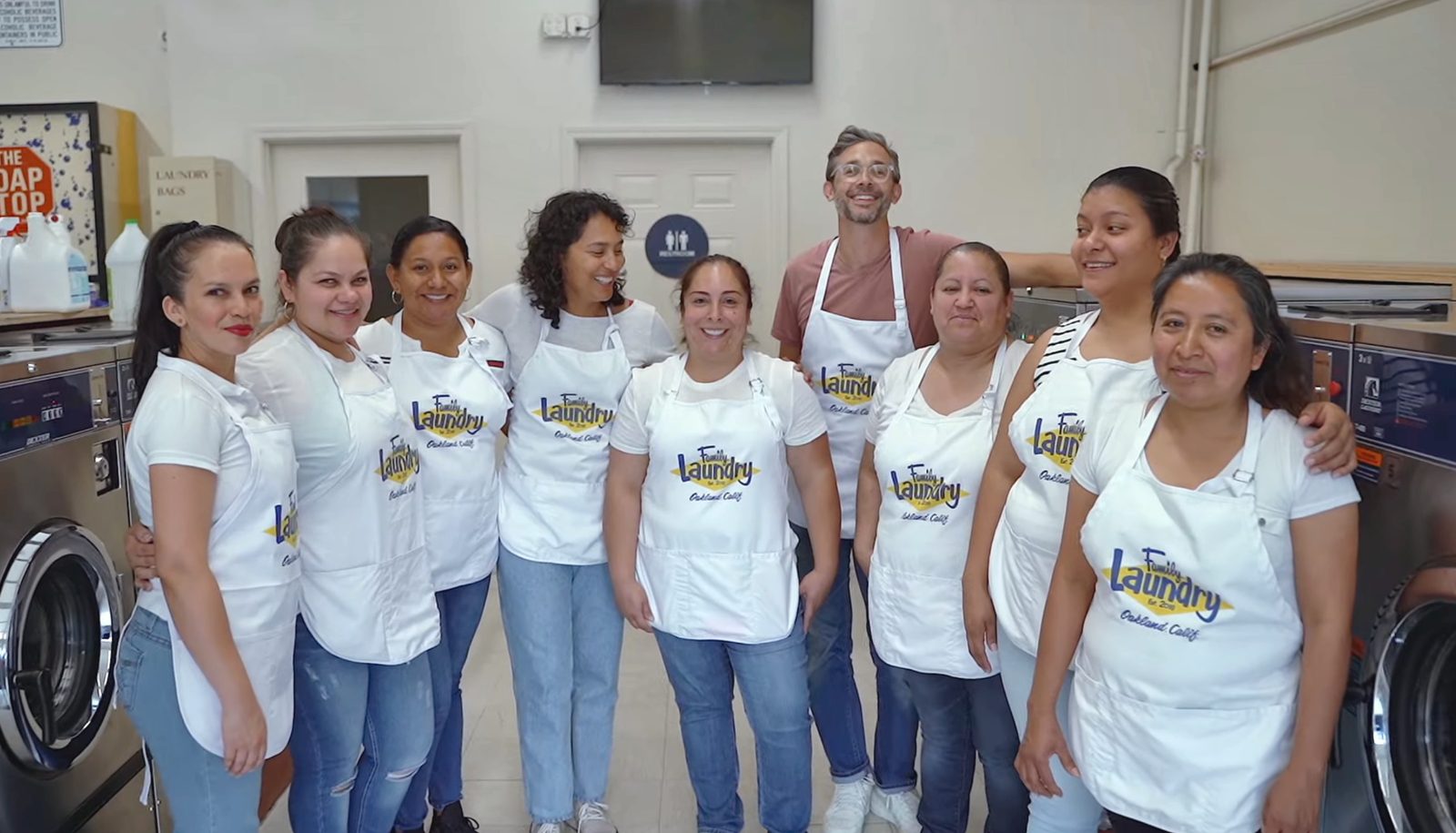 The Family Laundry team smiling together at the laundromat